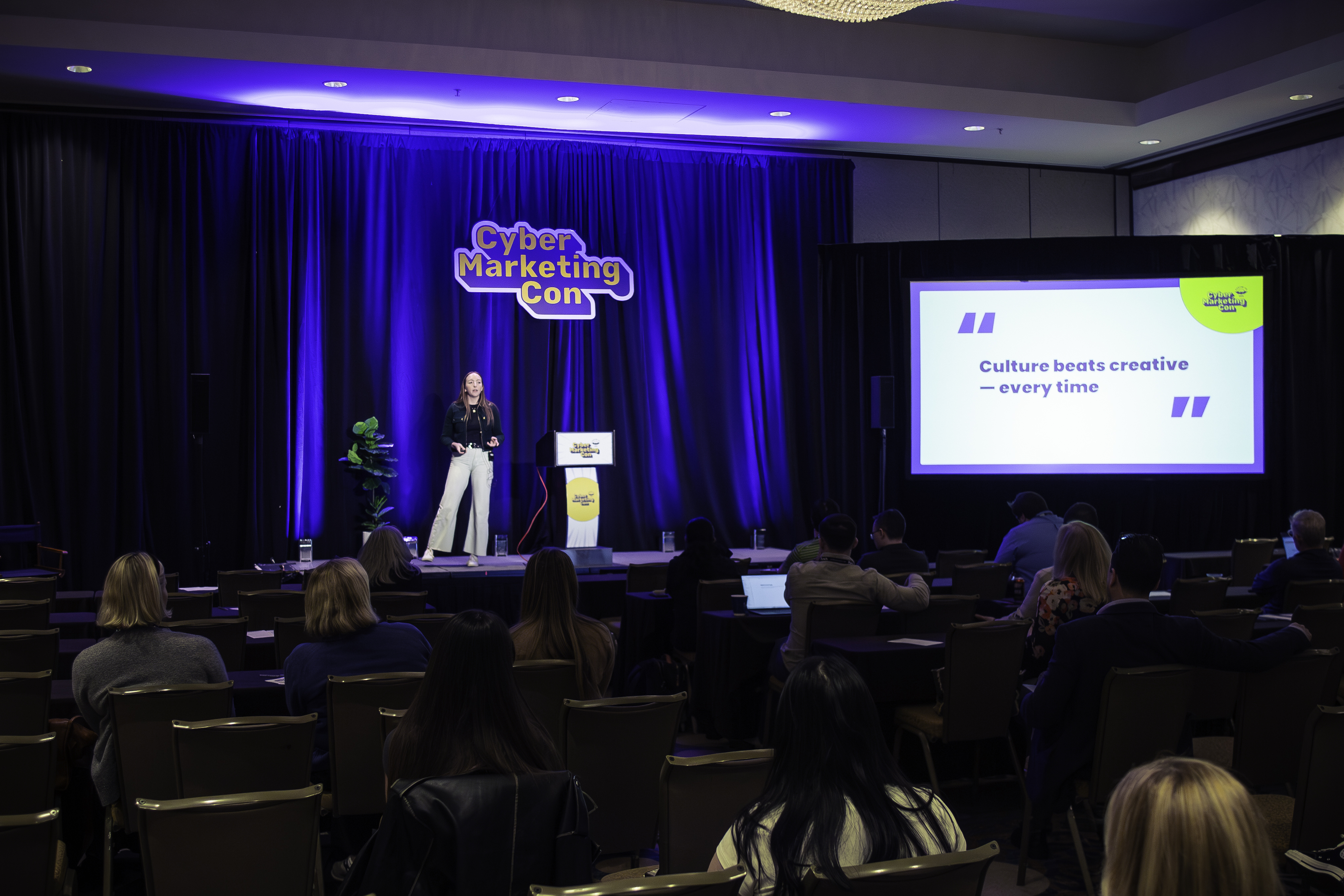 Hannah Laurence presenting on stage at CyberMarketingCon 2025